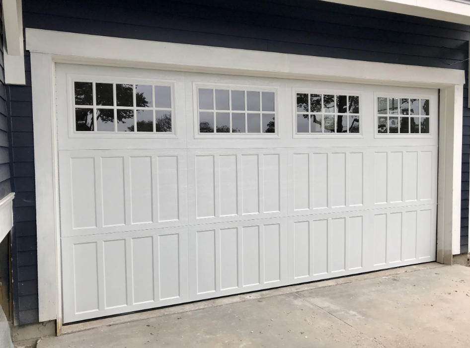 a professional technician performing garage door repair services in Orlando, FL, emphasizing