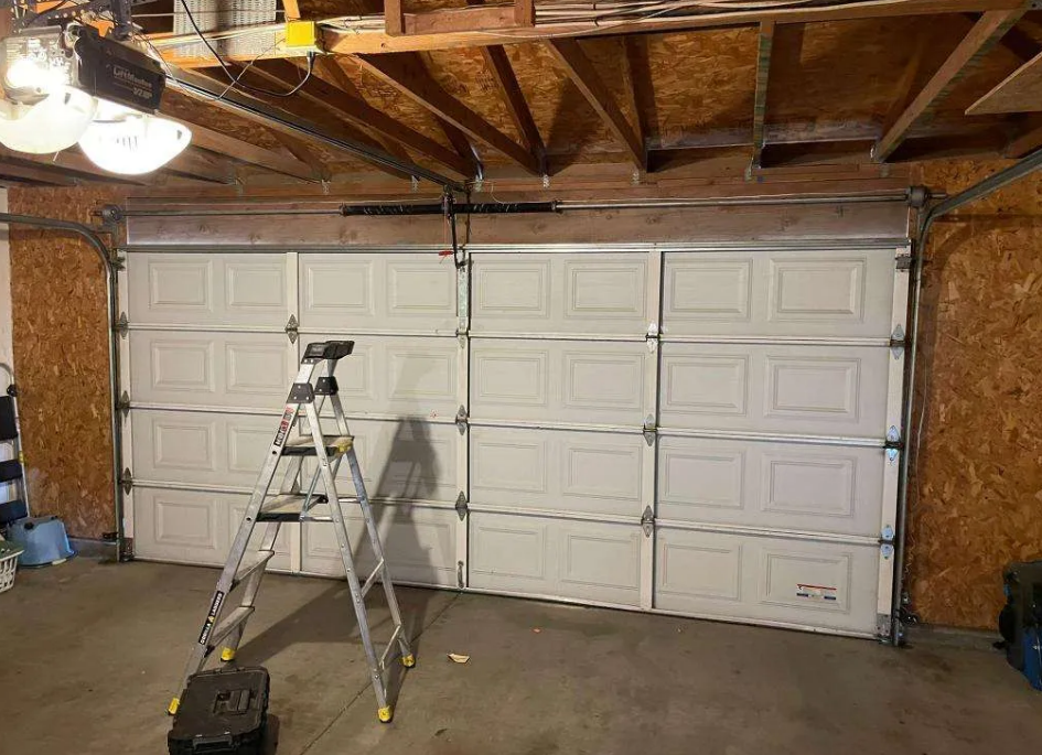 a professional technician repairing a residential garage door in Orlando, Florida. The technician is using tools to ensure the garage door operates smoothly and efficiently. The image represents the high-quality garage door repair services provided by Orlando FL Garage Door Repair Services, emphasizing reliability and expertise.