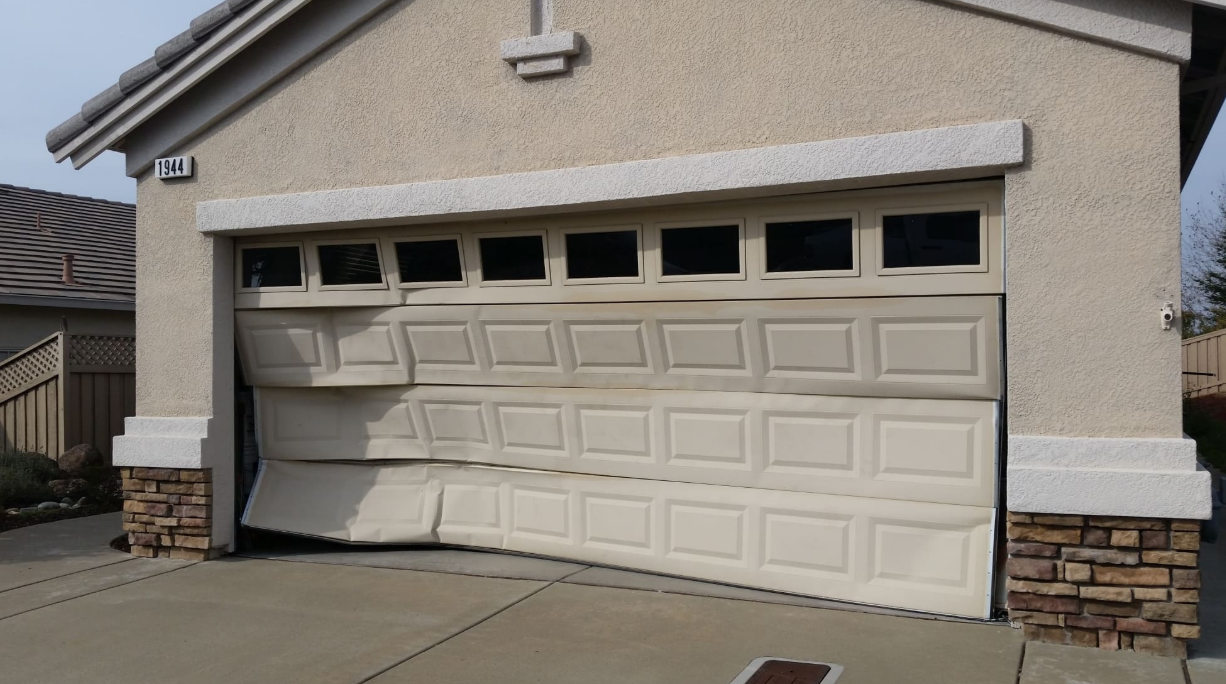 Technician repairing a garage door spring in Orlando, FL - Orlando FL Garage Door Repair Services