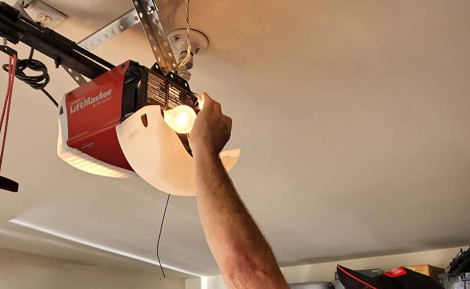 Expert technician repairing a garage door opener in Orlando, FL for enhanced safety and functionality – Orlando FL Garage Door Repair Services."